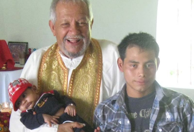 The late Fr. Andrés Girón, blessing a child in Nueva Concepción