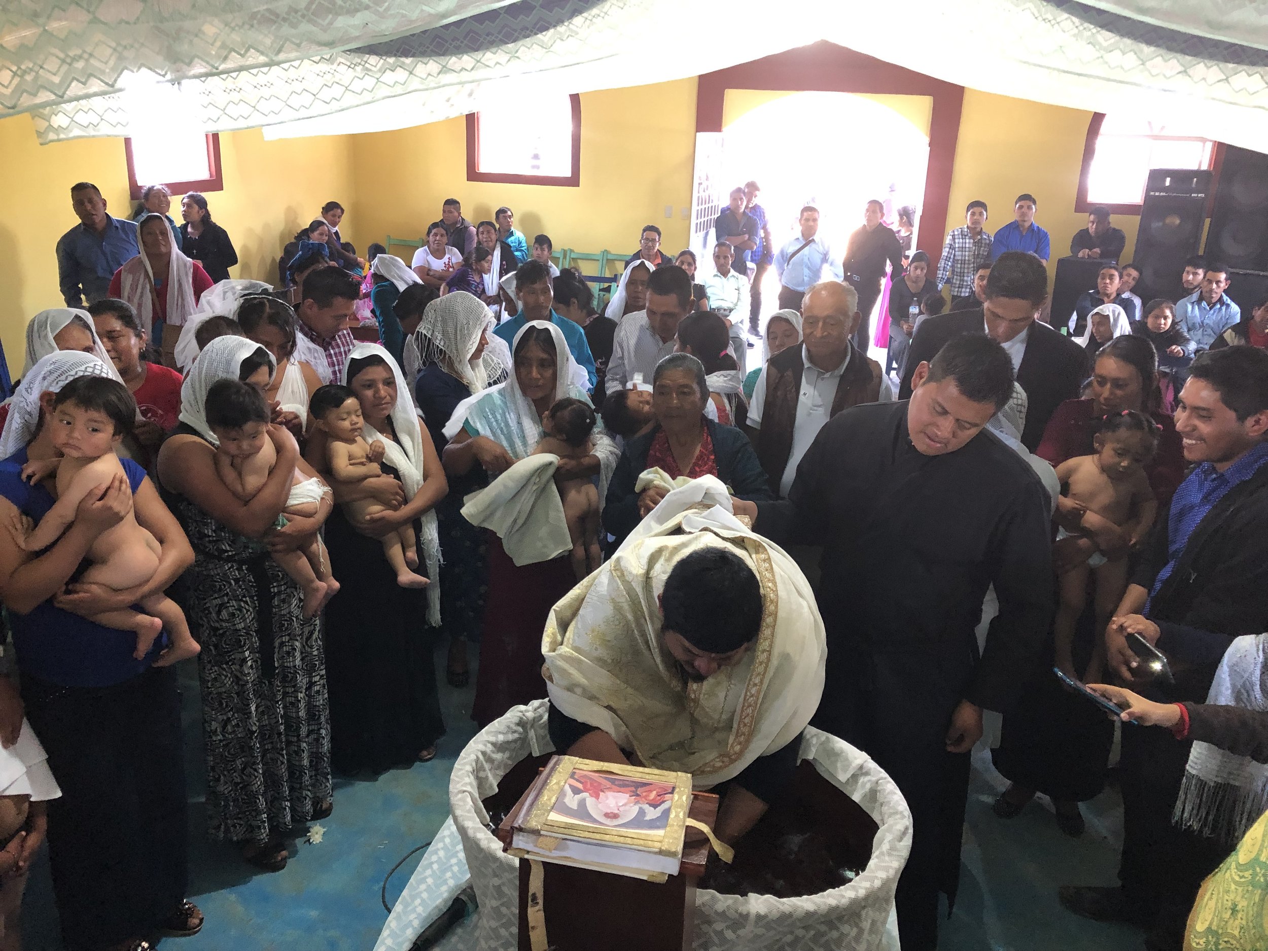 Fr. Evangelos prepares for ten baptisms at the church of San Caralampio