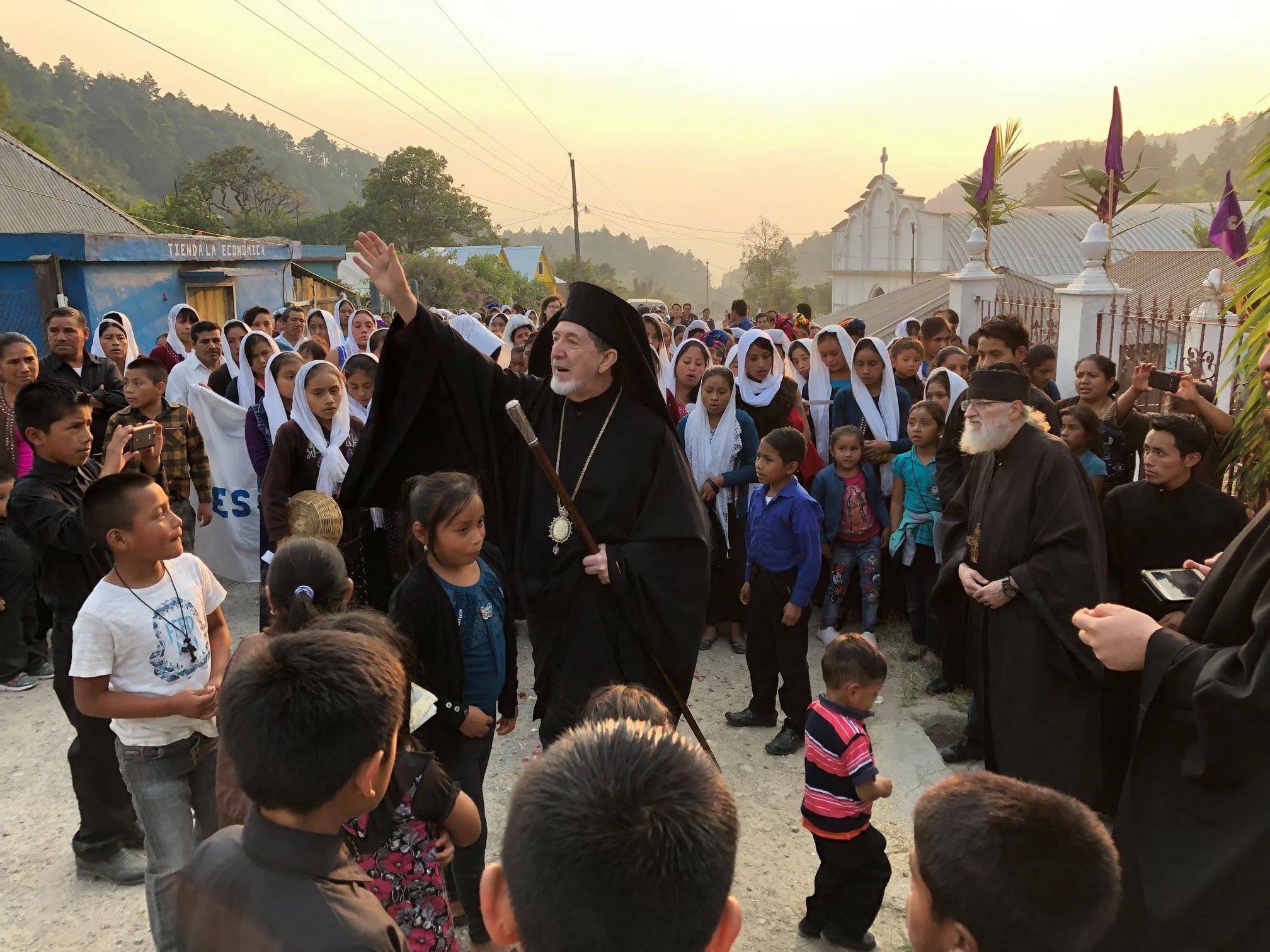 Greeting the Archbishop upon his arrival into the village