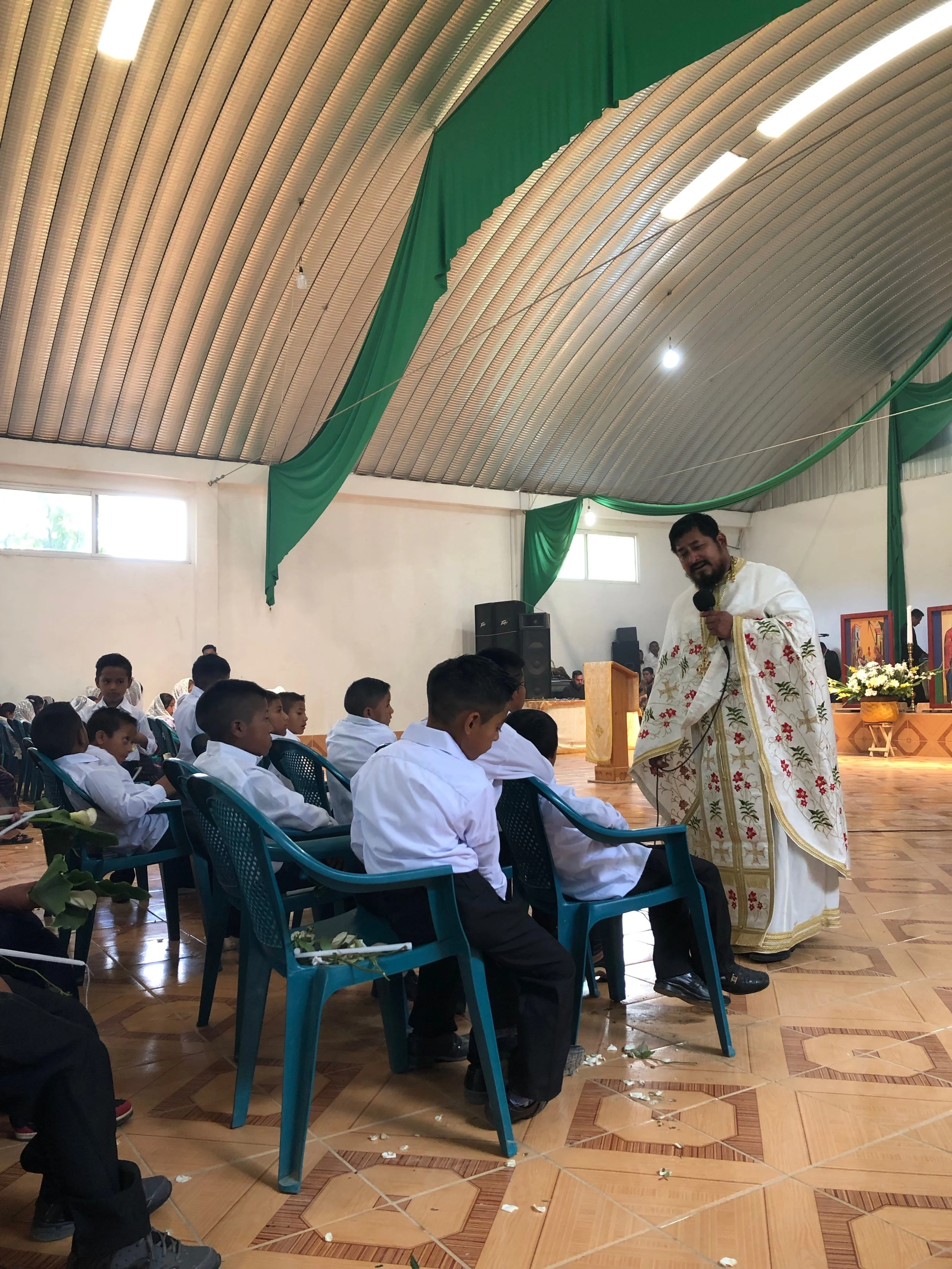 V. Rev. Fr. Evangelos preaching on the importance of the Saints and Church Fathers and choosing a baptismal name. 154 Chrismations were done this day!
