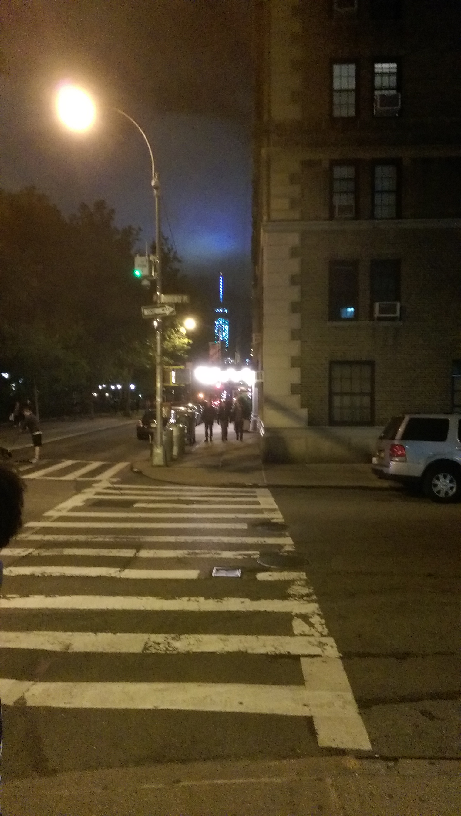 The corner of Waverly Place and Washington Square W at night... that explains all the lit buildings I bet. 