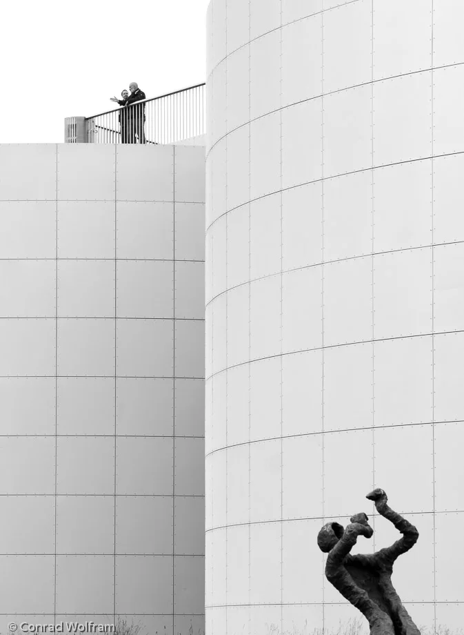 Juxtaposed people and sculpture