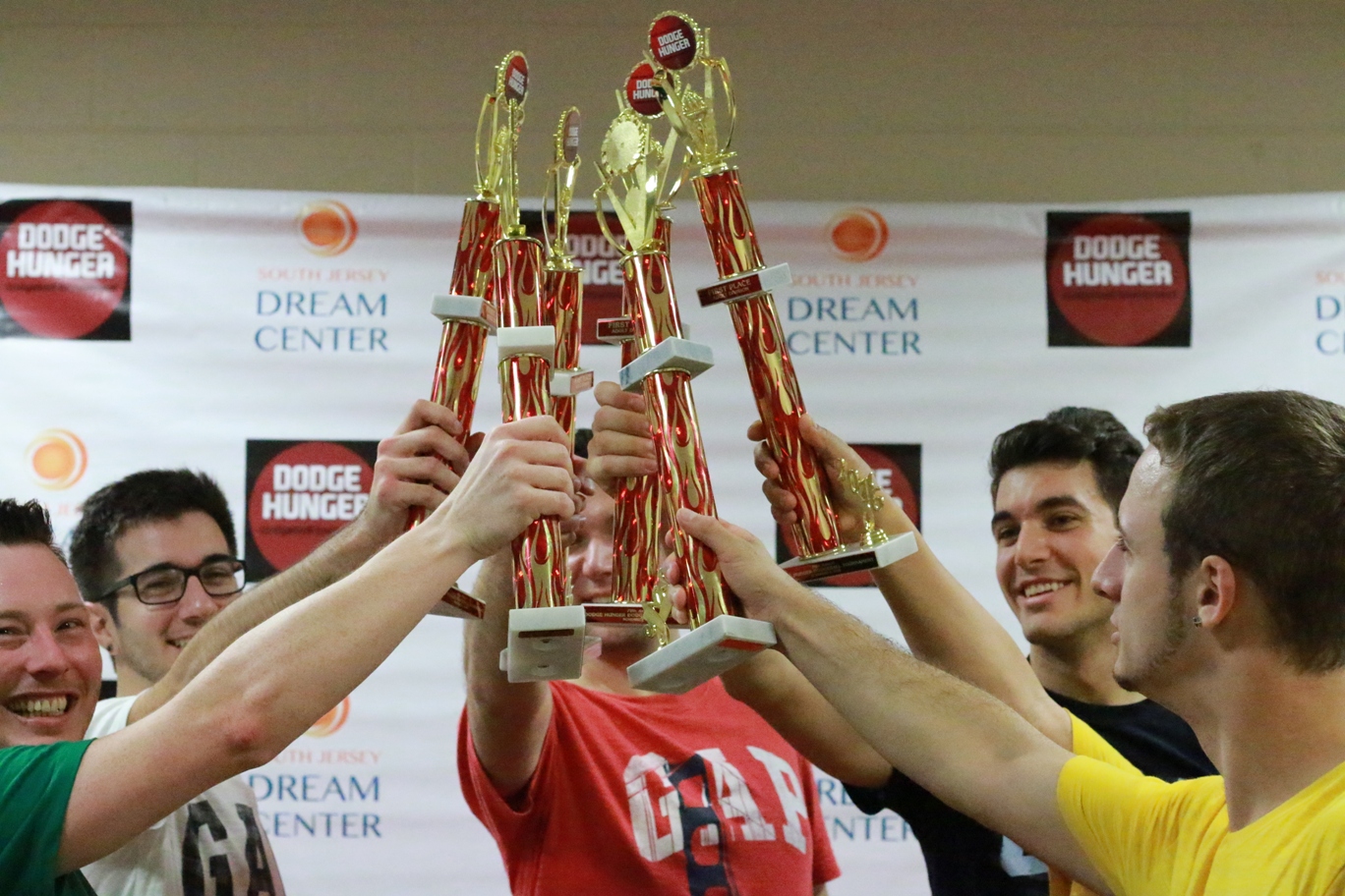 Adult Division, Team GAP Factory Store, celebrates first place honors lead by Team Captain Tom Magnuson (far left).