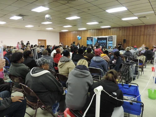 Guests waiting for workshop and food distribution to begin.