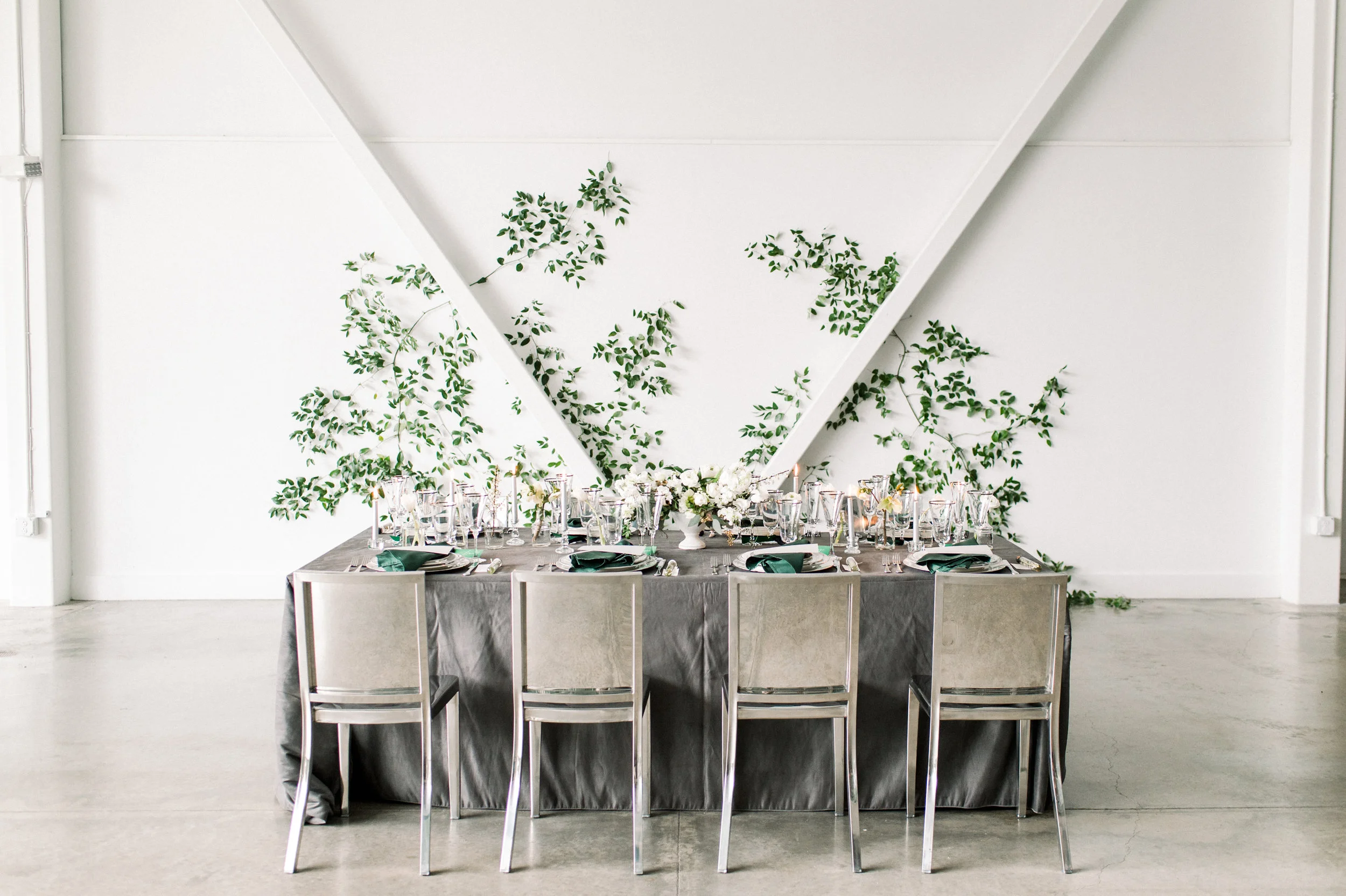 Artists for humanity epicenter wedding Boston wedding green botanical wedding inspiration ivy feature wall modern glamour candles white floral tablescape with velvet textures