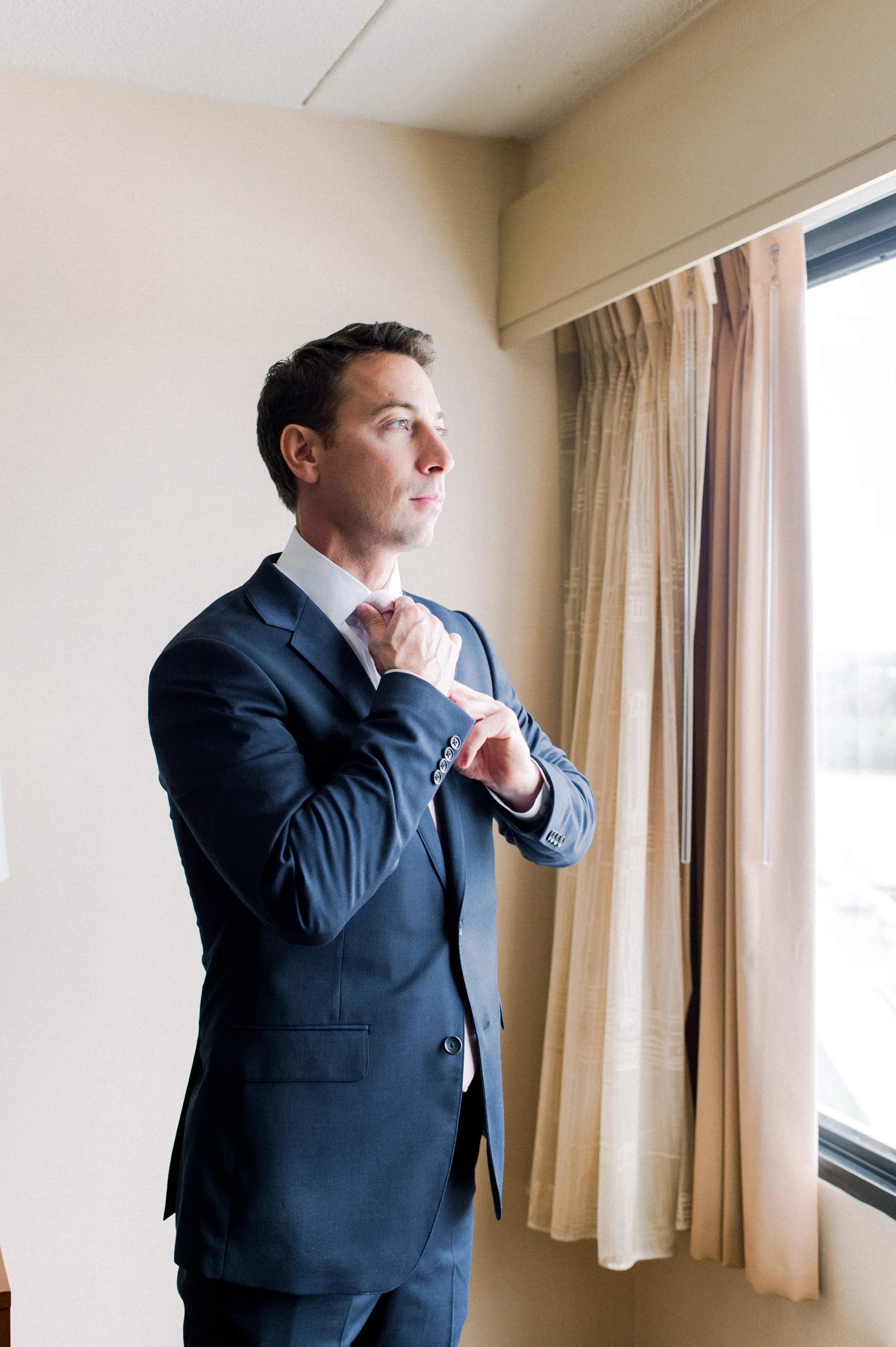 The Commons 1854 Topsfield MA wedding | Massachusetts wedding venue | Massachusetts wedding photography | groom getting ready | groom style | navy suit and pink tie