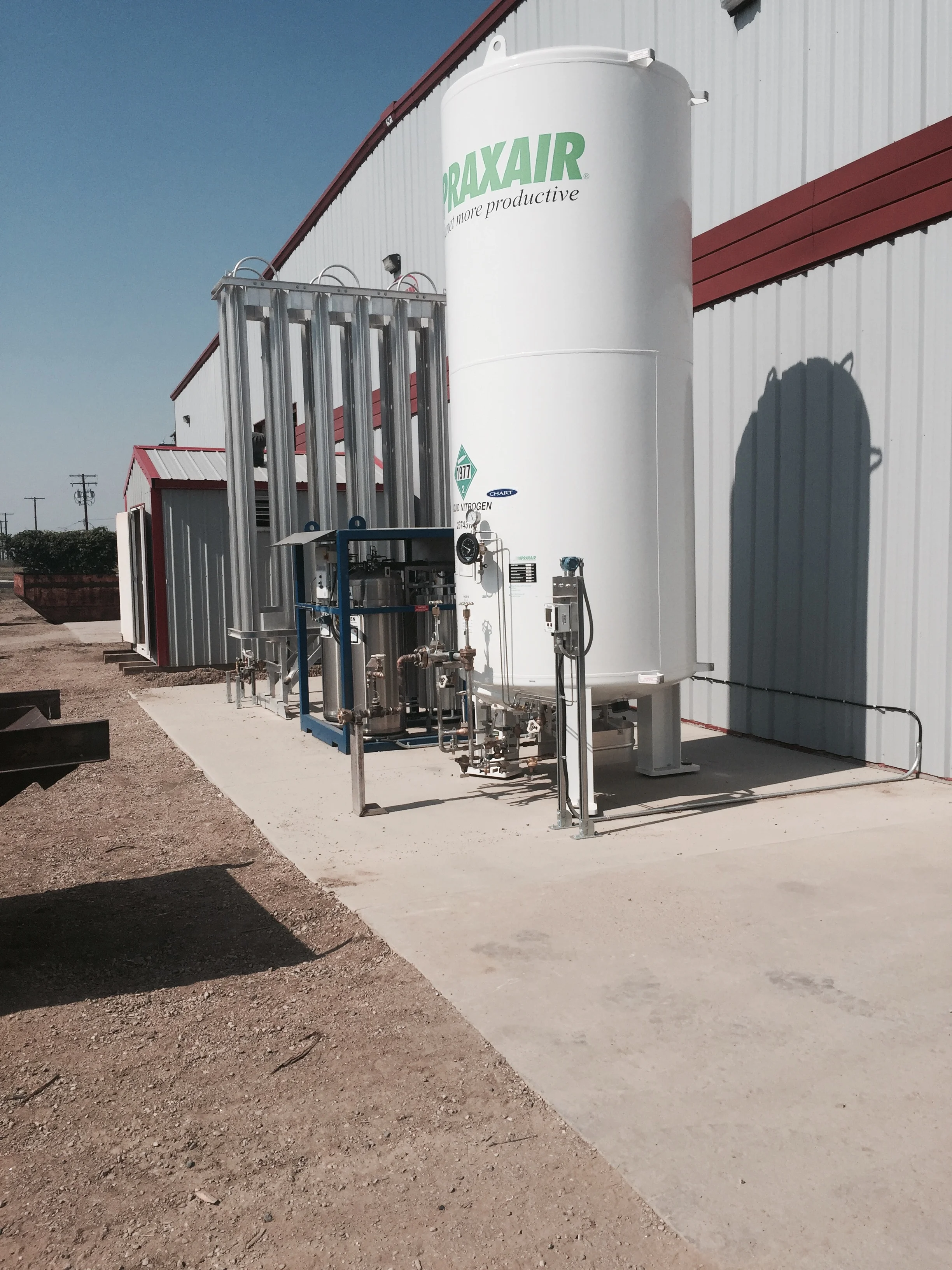Here is the Bulk Nitrogen storage situated on the concrete pad that we highlighted in a previous post. The Nitrogen is stored as a liquid and runs through the large aluminum structure to the left of the tank to change it from liquid to gas.