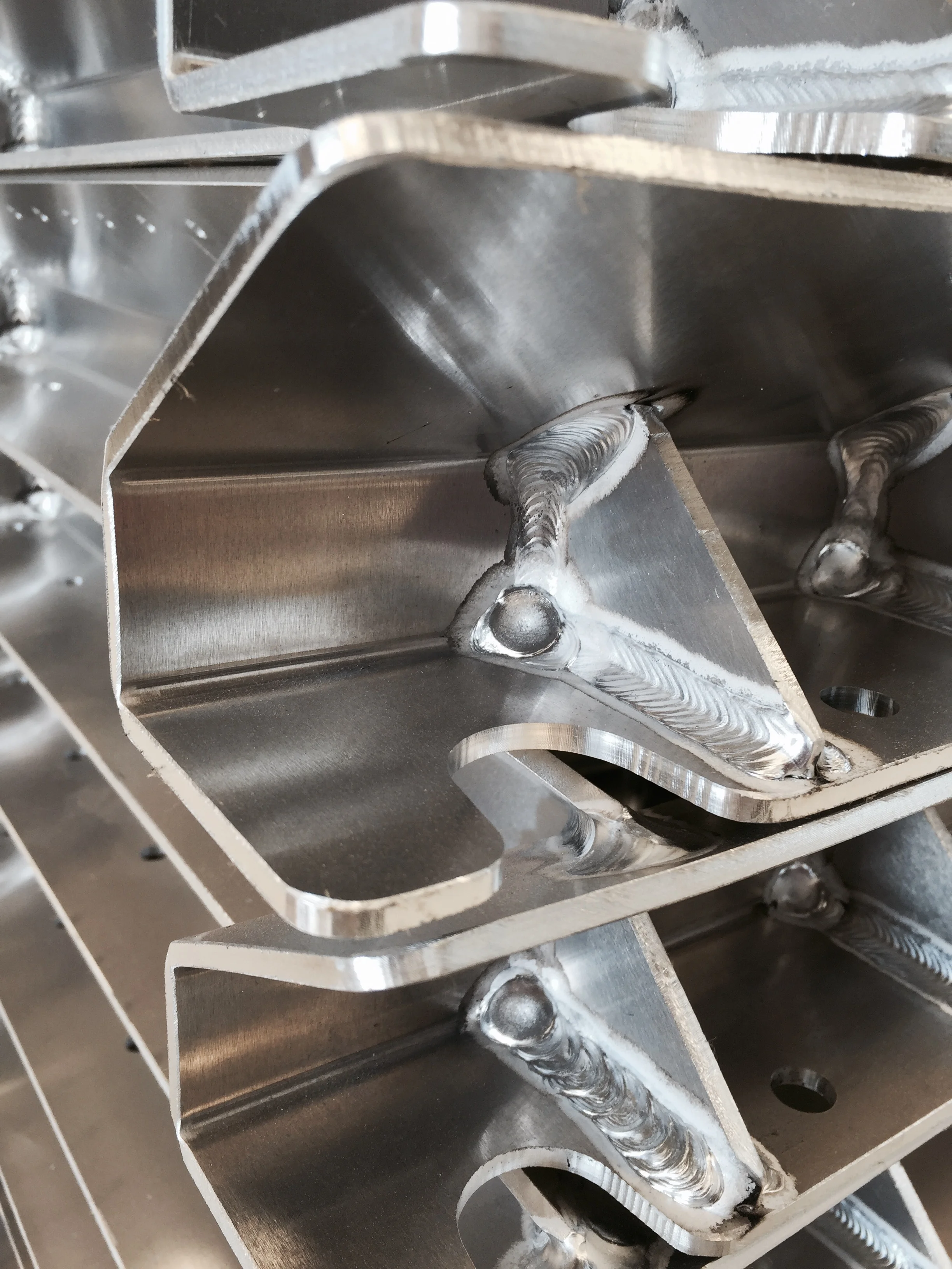 With the final assembly welded together, you cannot see depth cut slots anymore and everything was lined up perfectly for the robot to weld. This design makes for an extremely repeatable part that saves cost for Lean Machine and its customers.