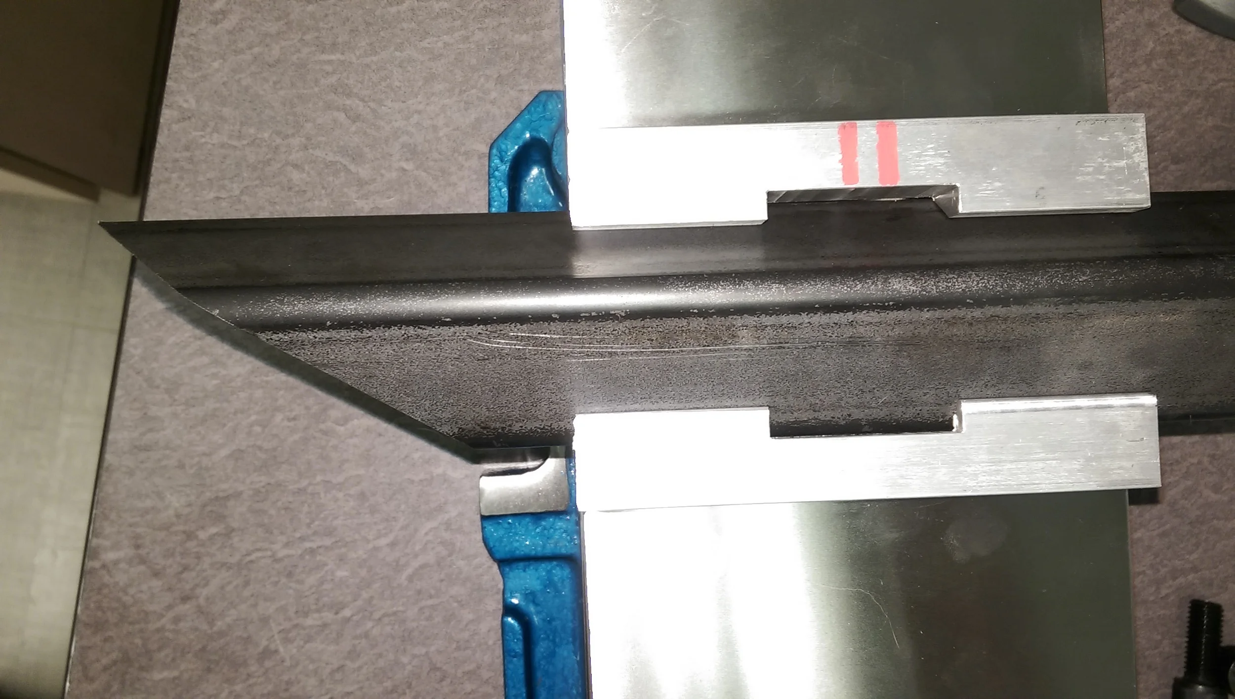 This is the top view of the set-up. Note the marking lines on the back jaw to make sure they go back in the machine correctly. The same marks are in the CAD model, so everything matches when the machinist sets up the job.