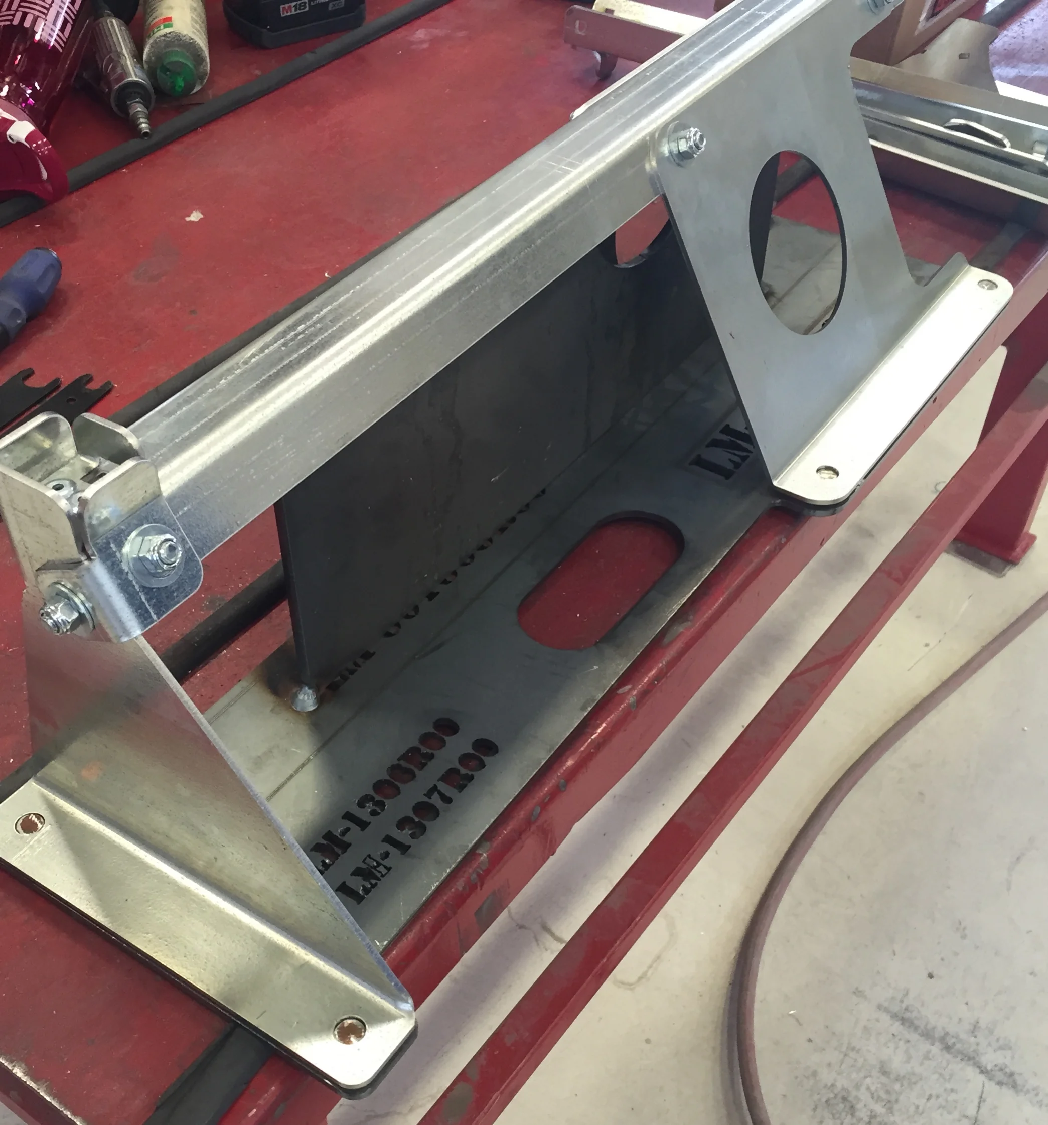 The galvanized steel sub-components are placed on the jig and bolted together.