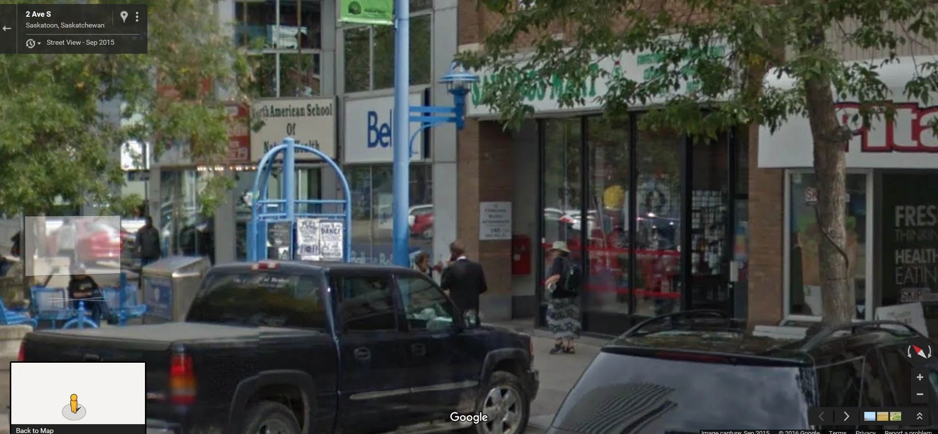 Here is a Google street view of an example of this part. If you can see the bracket attached to the pole, the sphere is opposite the light fixture.