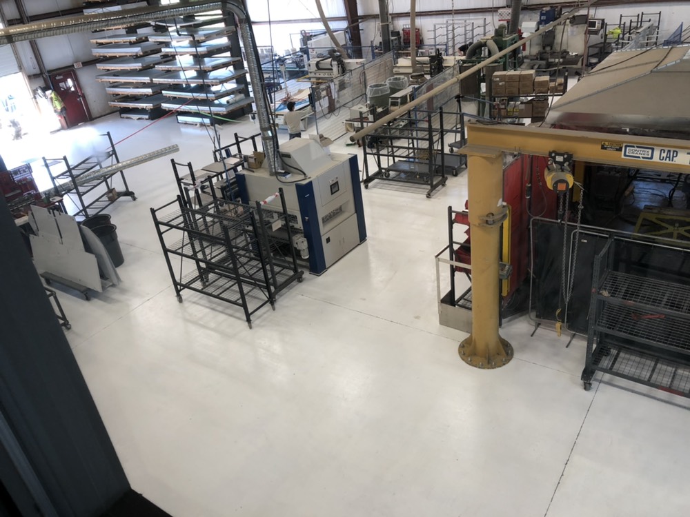 Amazing! It took 3 days and 6 people to make this happen. Why do we want our floor painted when it would just be easier (and cheaper) to have it bare concrete? Better light reflection, easier to sweep, and it makes us feel happy.
