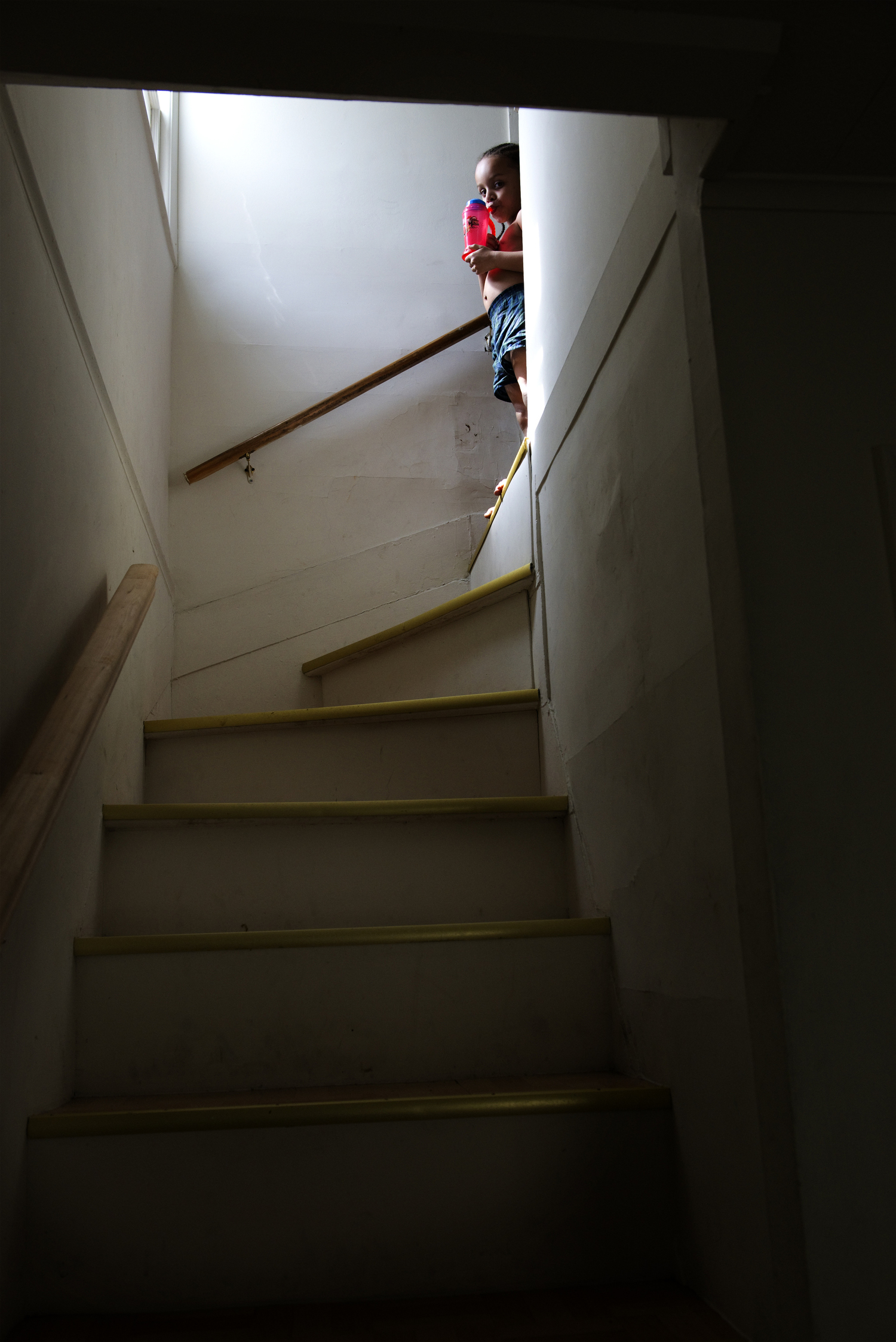  Jesiel Huertas, 4, waits at the top of the stairs for his mom to help him get dressed for school. 
