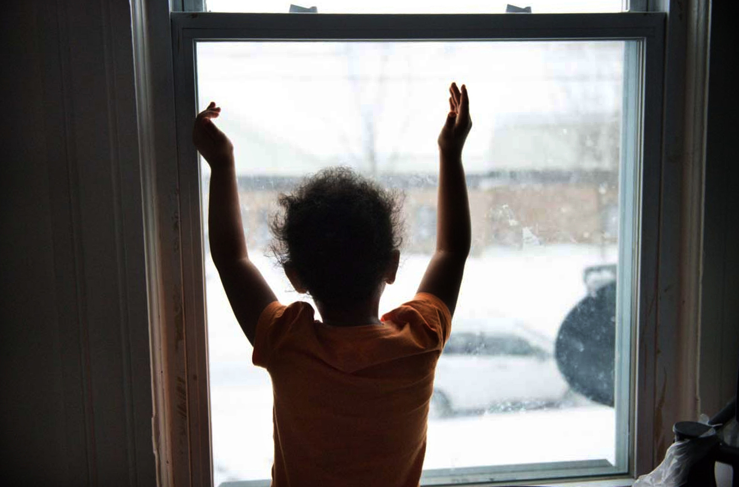  Lydianyz Huertas, 5, daughter of Lydia Huertas,&nbsp;watches snow fall from her bedroom window in Syracuse.&nbsp; 