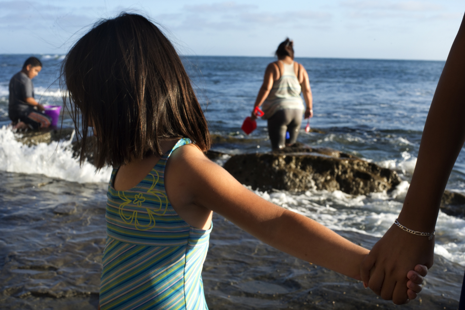 This is Ivania, known as Panda in her family. "She looks Chinese!," her mother Marcella said to me. "But she's just plain Mexican!" Ivania and her family were hunting for crabs and waiting for sunset at Sunset Cliffs Natural Park.