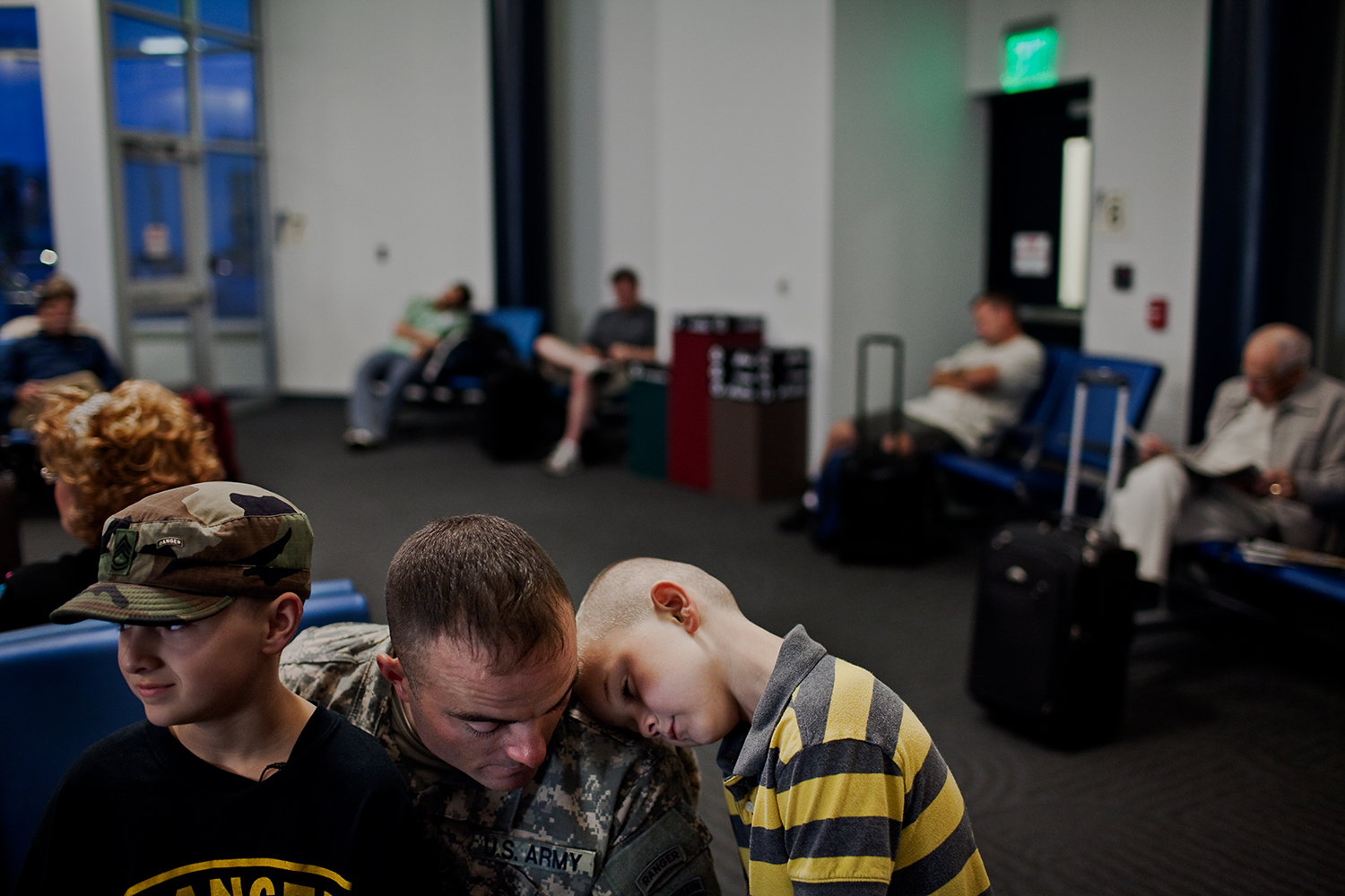  Joey and Issac spend what little time they had left with their father, Sergeant First Class Eisch before his flight departs from Appleton, Wis. Sergeant Eisch has to resume his tour of duty in Afghanistan.&nbsp; 