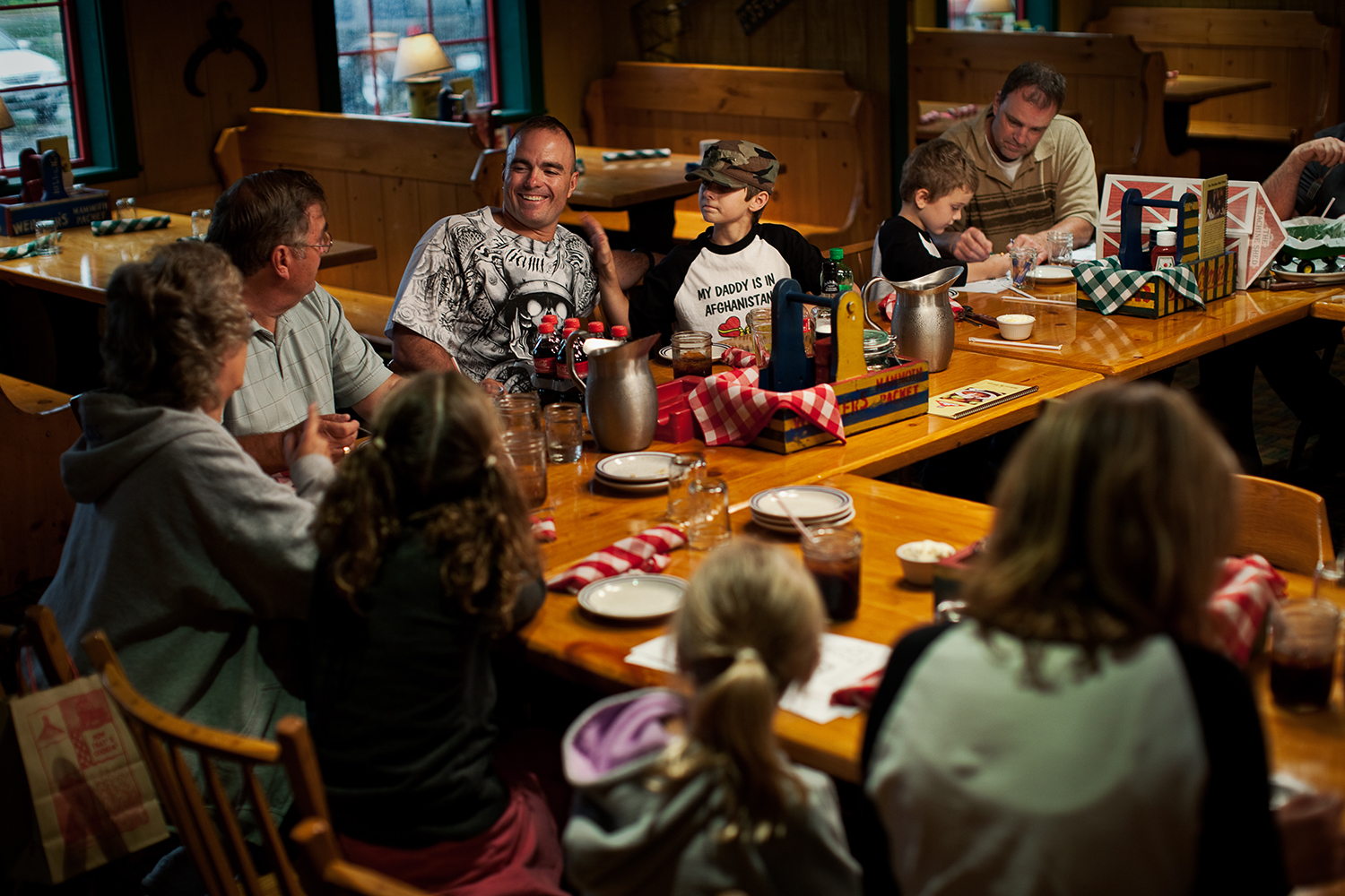  Friends and family of the Eisch family dine together to celebrate Sergeant First Class Brian Eisch's mid-tour leave in Appleton, Wis. 