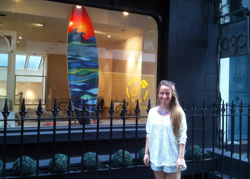 Maia and her surfboard artwork.