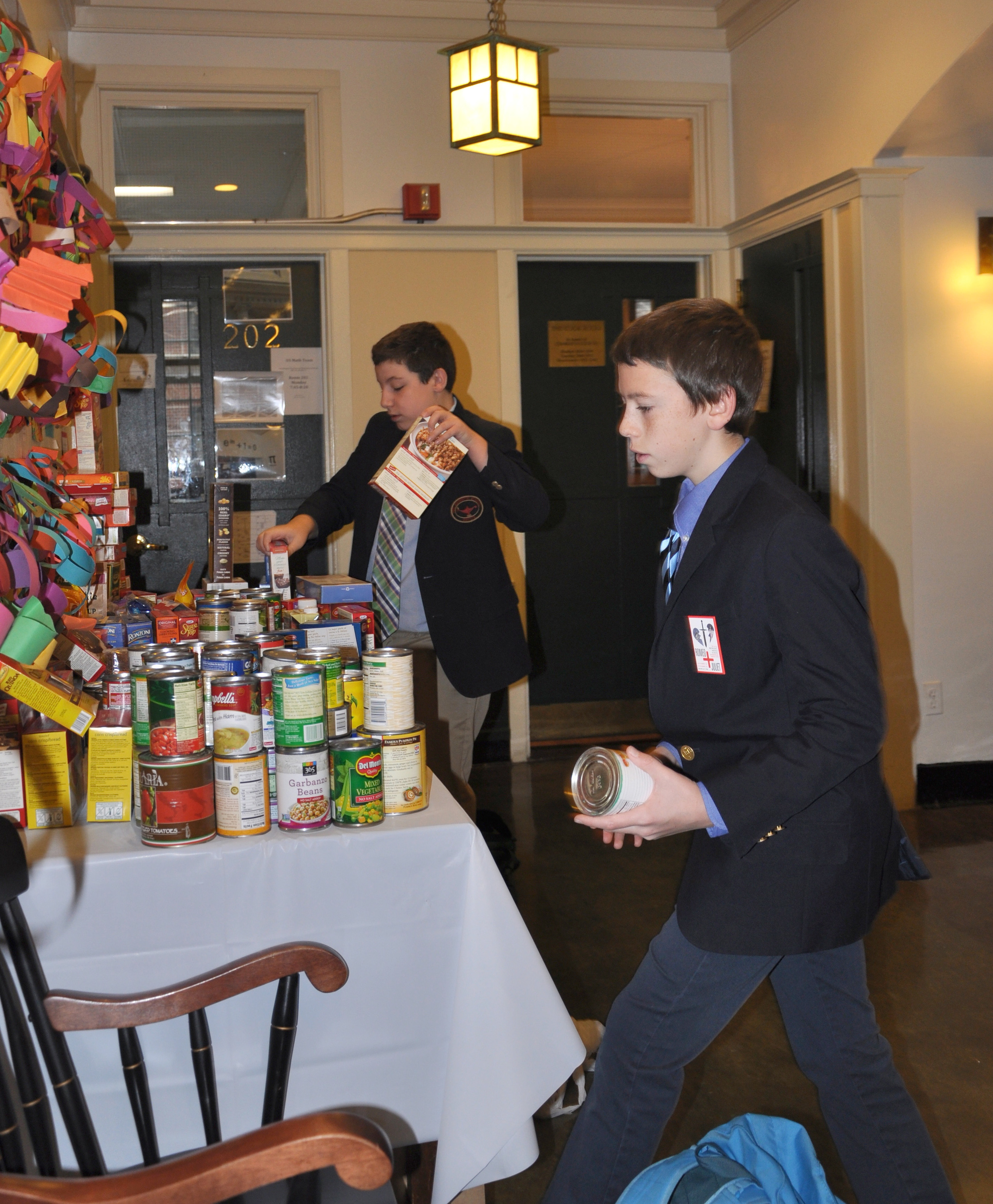  Middle School students donate canned food. 