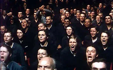 But even as we grasp at victory, there is a cancer, an evil tumour, growing, spreading in our midst. Shout. Shout! Shout out his name! BUNDY!