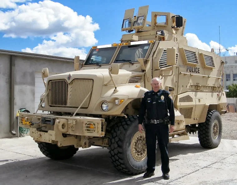 Chief Ken Geddes poses with the Preston, Idaho police department's new MRAP. See Will Grigg's article on this.