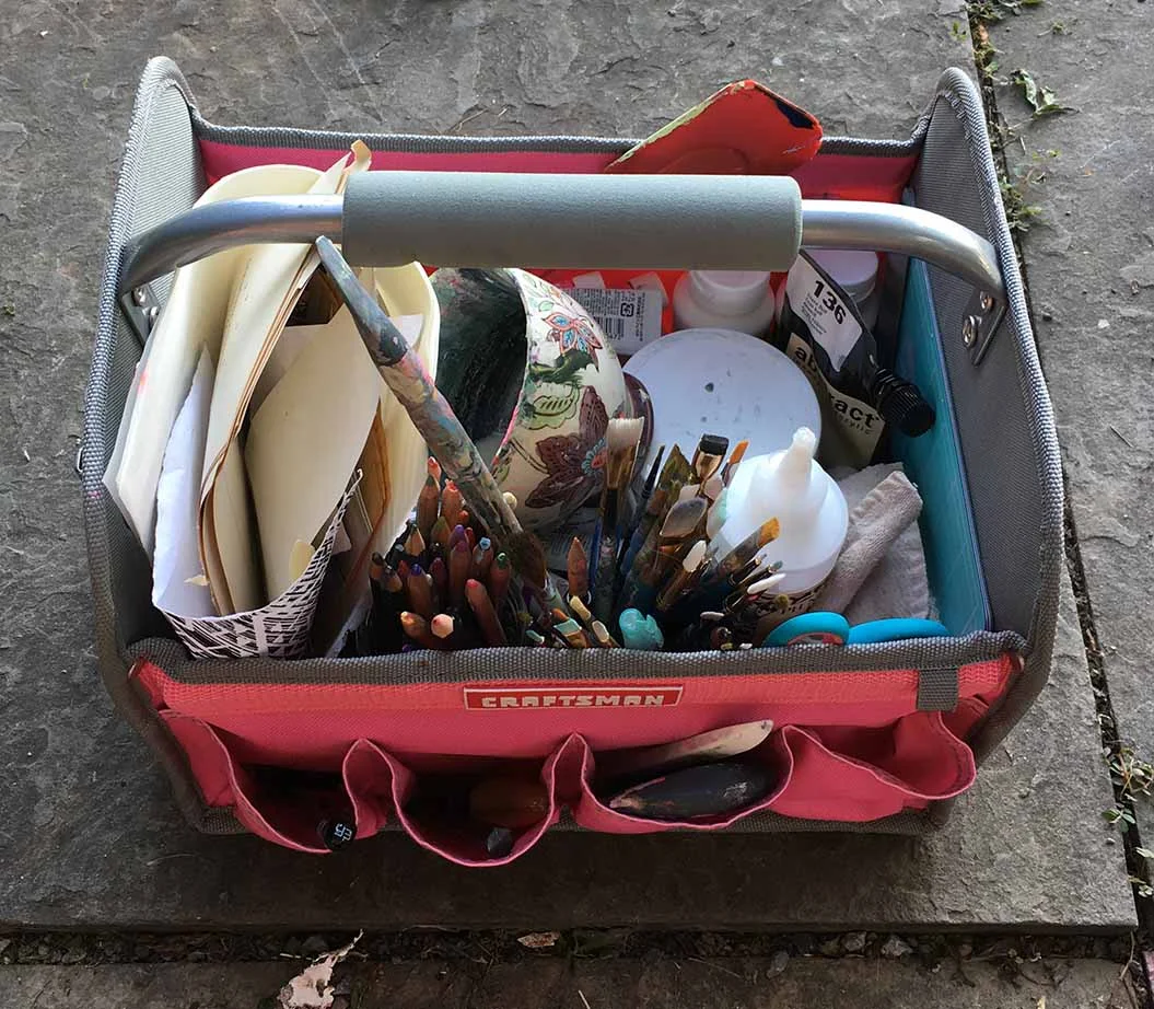 Supplies I brought on my beach trip: some found papers, water soluble pencils, brushes, spatulas, teflon folder, x-acto knife, scissors, cup for water, gouache, acrylic paint, matte medium, etc.