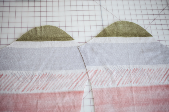 Asymmetric sleeve caps.