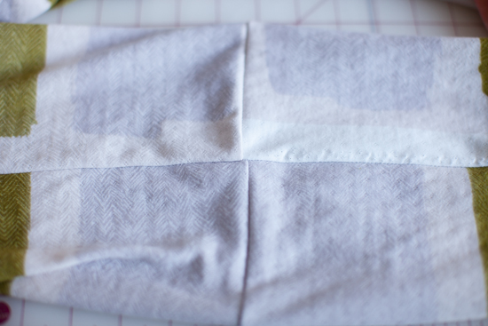 The short seams "lined up", and the long seam horizontal.