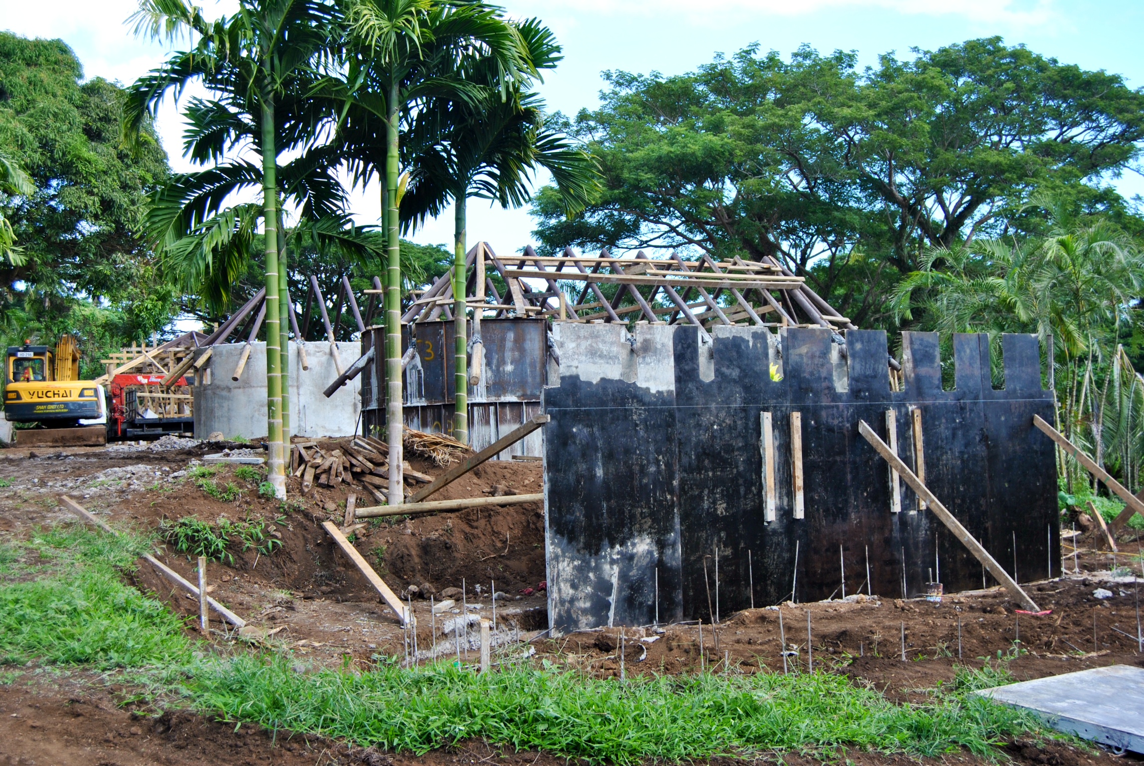 Bure 1 in the background with the forms removed and the rafters in place. Bure 2 is in the middle, and Bure 3 is being formed up in the foreground. Talk about fantastic progress.