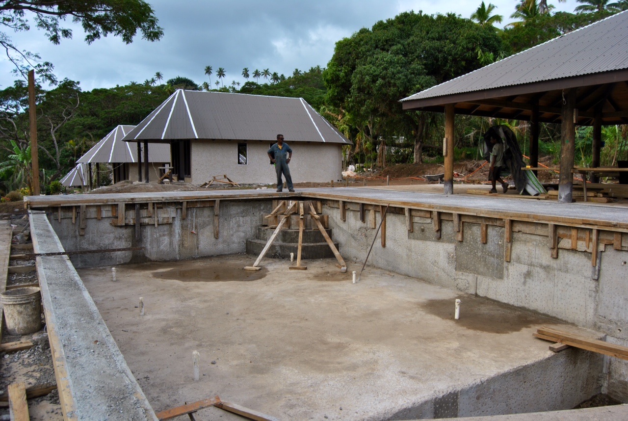 The pool is beginning to look very pool-ish. Note the infinity edge towards the left of the photo.