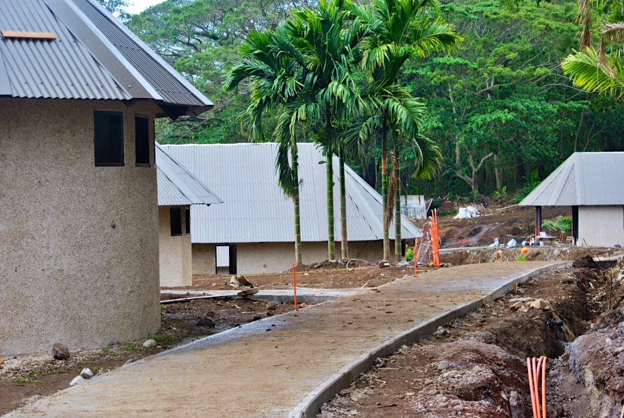 We originally considered crushed rock or coral for our pathways, but realized that some of our guests were mobility-impaired. To accommodate the diverse needs of our guests, we decided to pour concrete walkways -- but long open curves were used to keep the meandering feel to the property.