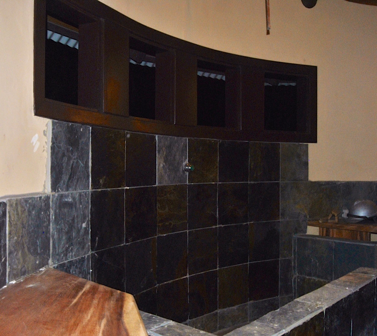 In the bathrooms, they are beginning to seal the tile in the showers. Love the contrast between the tile, walls, and wood!