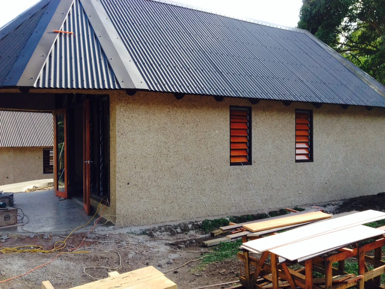 This is the exterior of Bure 1 looking north. Note the french doors and finished windows. Next stop — interior finish work and landscaping for our first guests!
