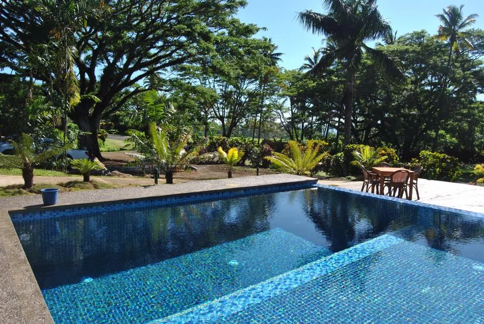 The pool. In the distance are the tennis courts of Soqulu Country Club