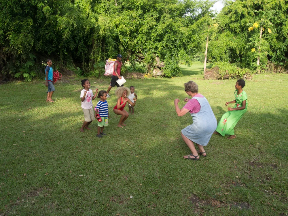 Mom (Muriel) teaching the kids at our christmas party the chicken dance!