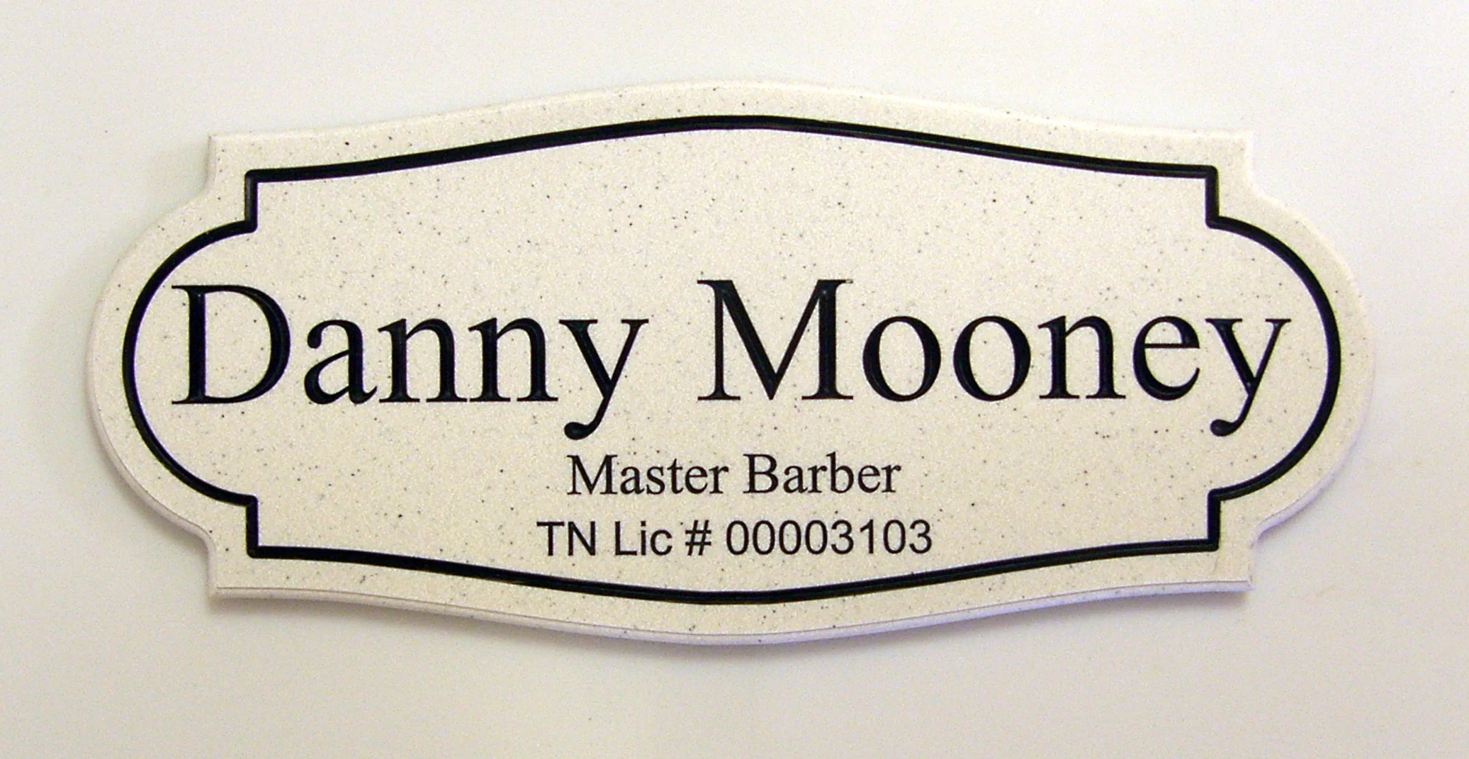 Name plaque with required License number that needs to be present at place of business.  Typical Cost: $35