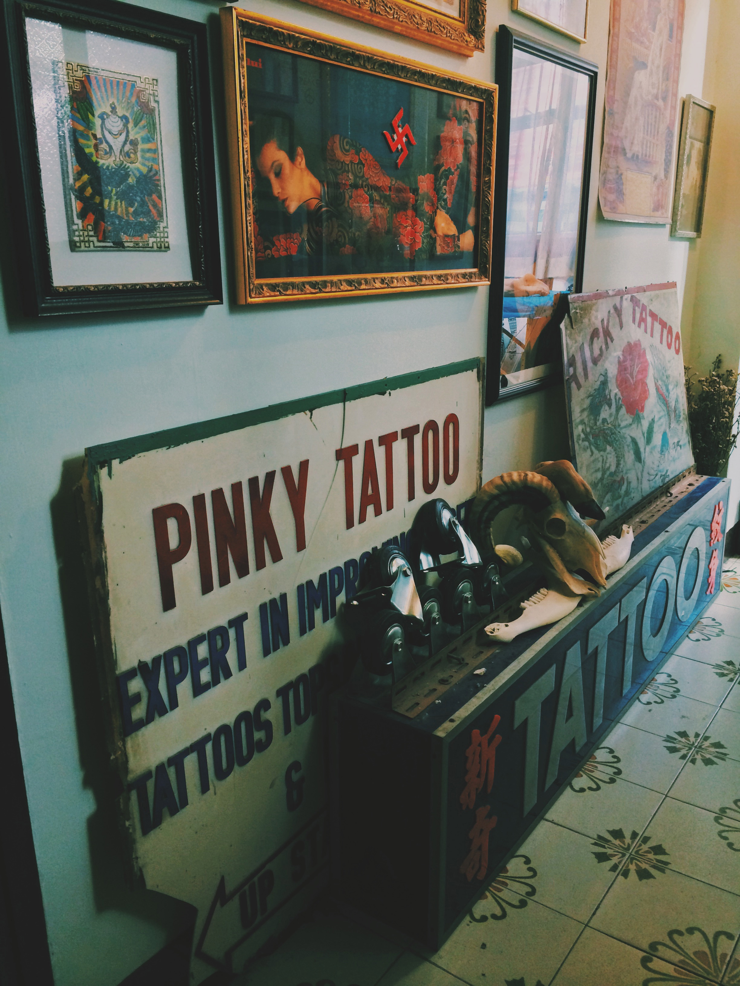 Pinky and Ricky tattoo shopfronts signs in Mei Wah, Hong Kong. 