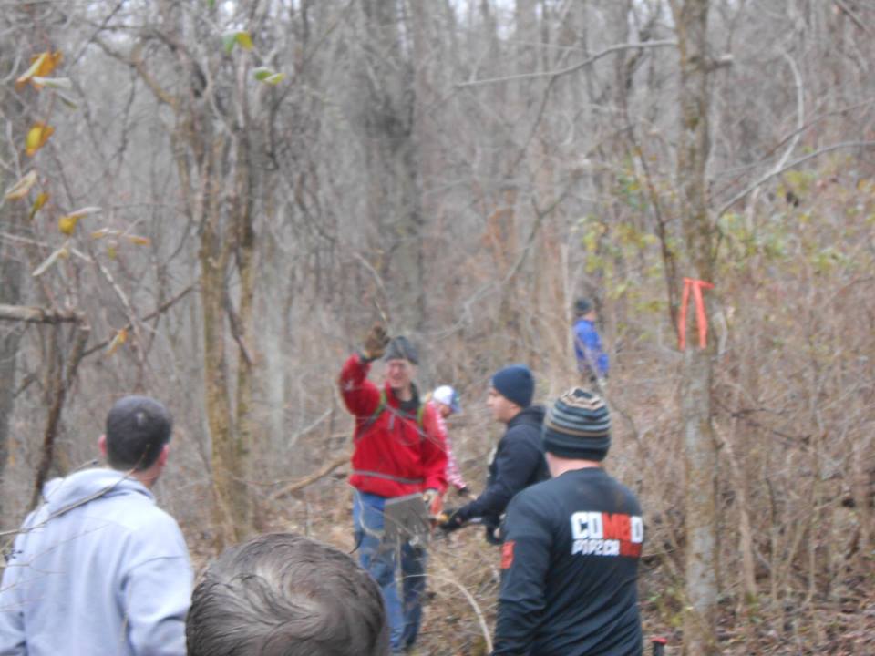 Black shirt in action on a trail day