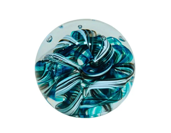 A glass marble with swirling blue, white, and black patterns inside.