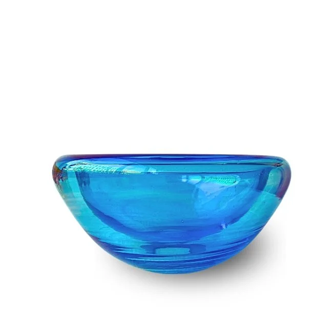 Blue glass bowl on a white background