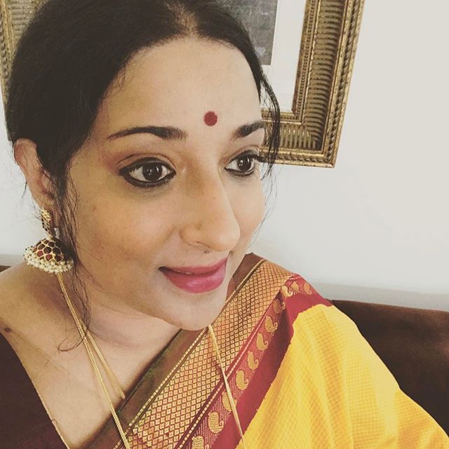 Heading out to the temple in one of my #Gadwal saris! I shelved this sari for nearly six years since I bought it thinking I made a mistake with the color but the bright yellow cotton paired with a lovely deep maroon and green silk border with silver 