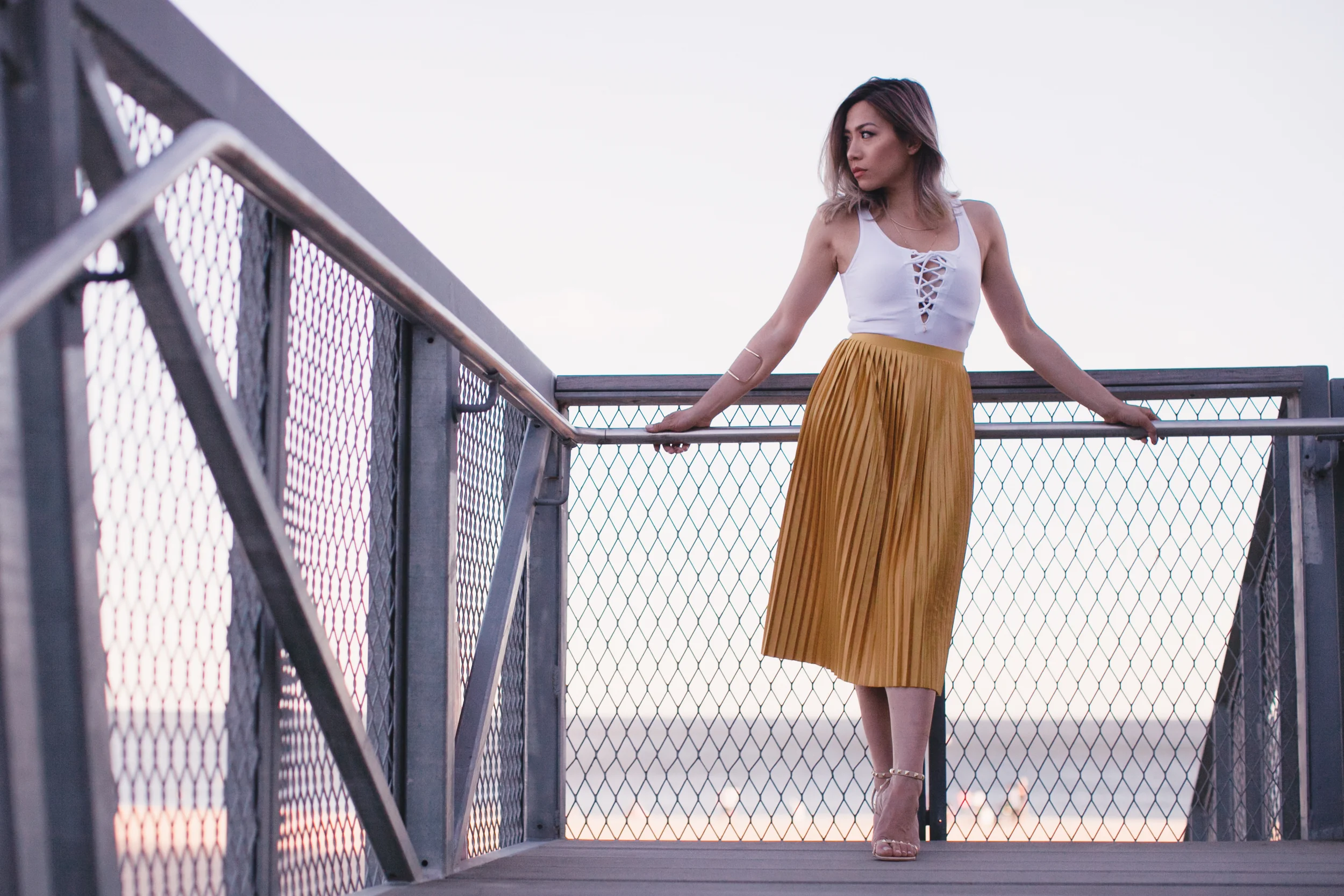 White Front Lace Bodysuit- TopShop | Mustard Yellow Silk Pleated Skirt - TopShop | Kecia Stud pumps - Shoedazzle 
