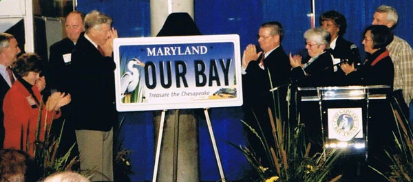 MD Governor Hughes and CBT Board Members unveil the new Bay Plate at the National Aquarium in Baltimore.