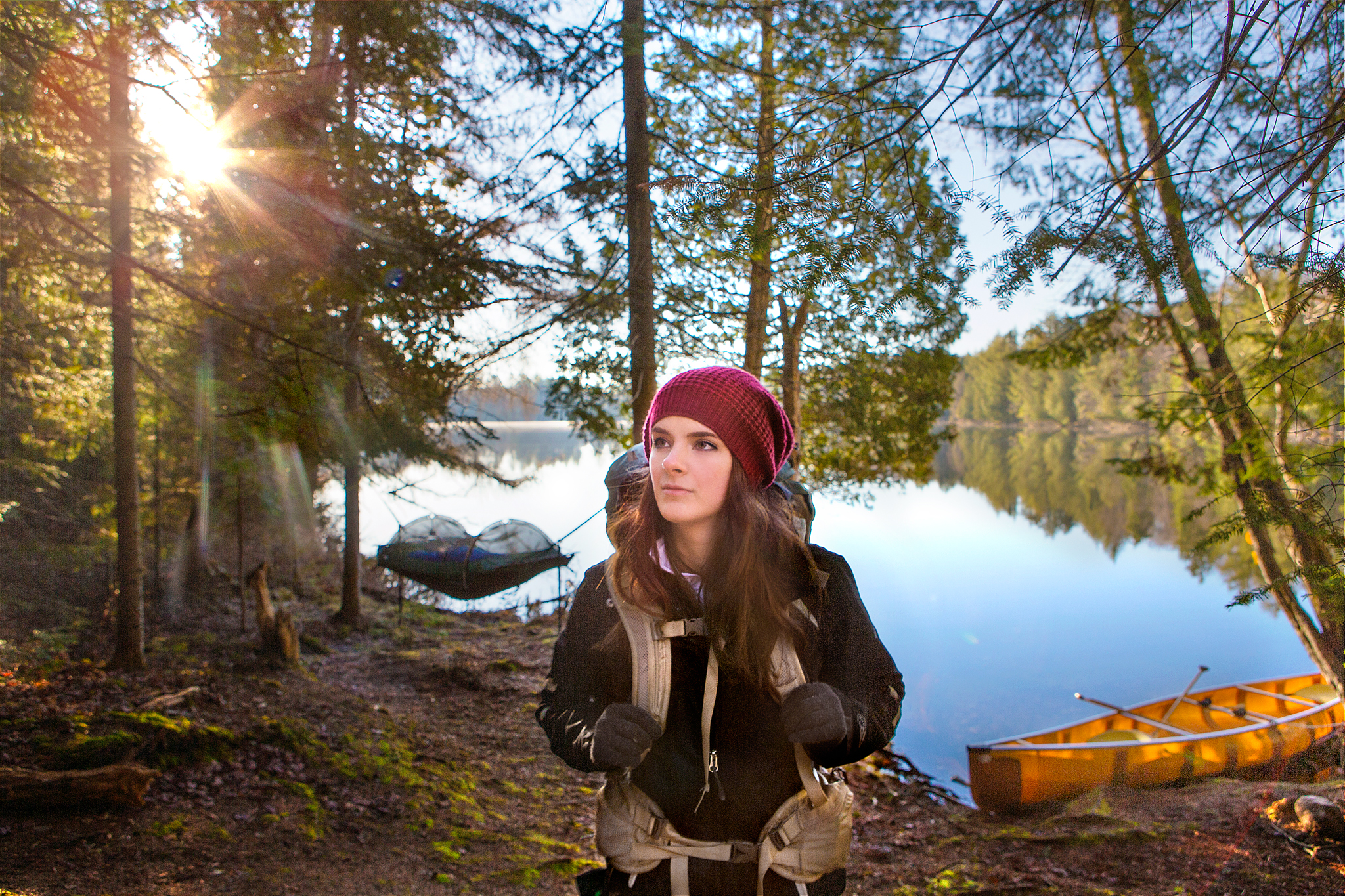 Nicole at our first campsite with the Lawson Hammock and Wenonah Canoe in the background