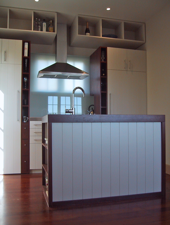 Contemporary kitchen for a brick Arts & Crafts cottage.