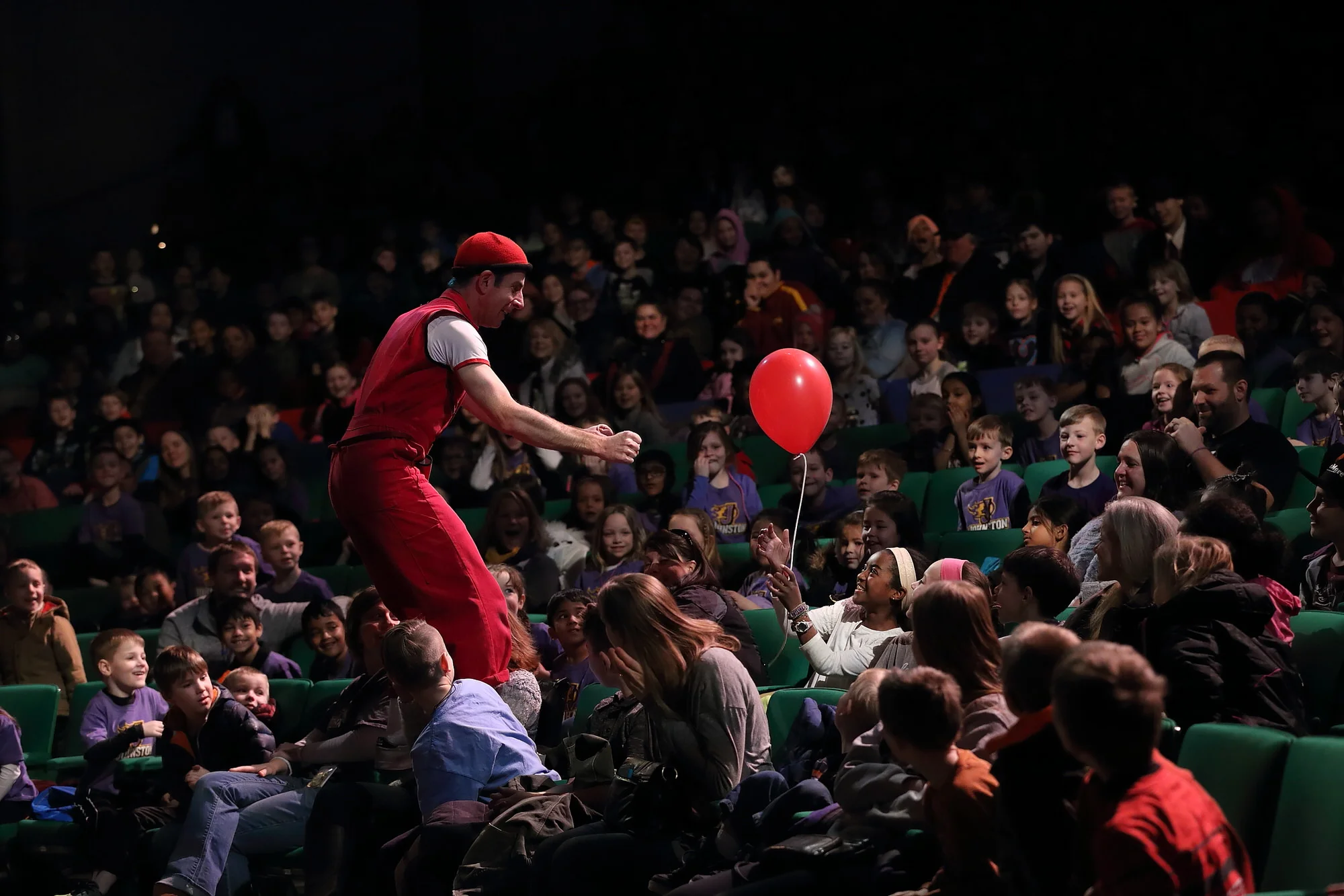acrobuffos_airplayshow-des_moines-seth_bloom-in-audience-with-balloon.JPG