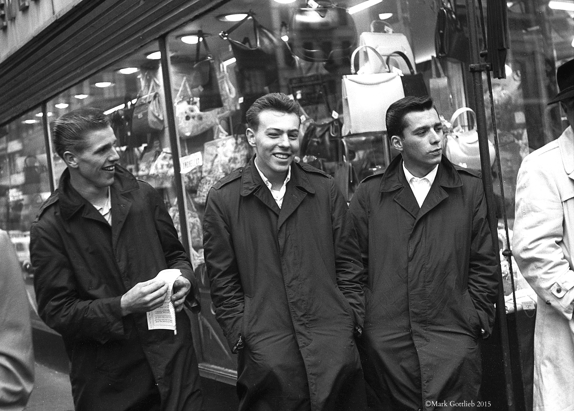 Three Guys in Black Raincoats