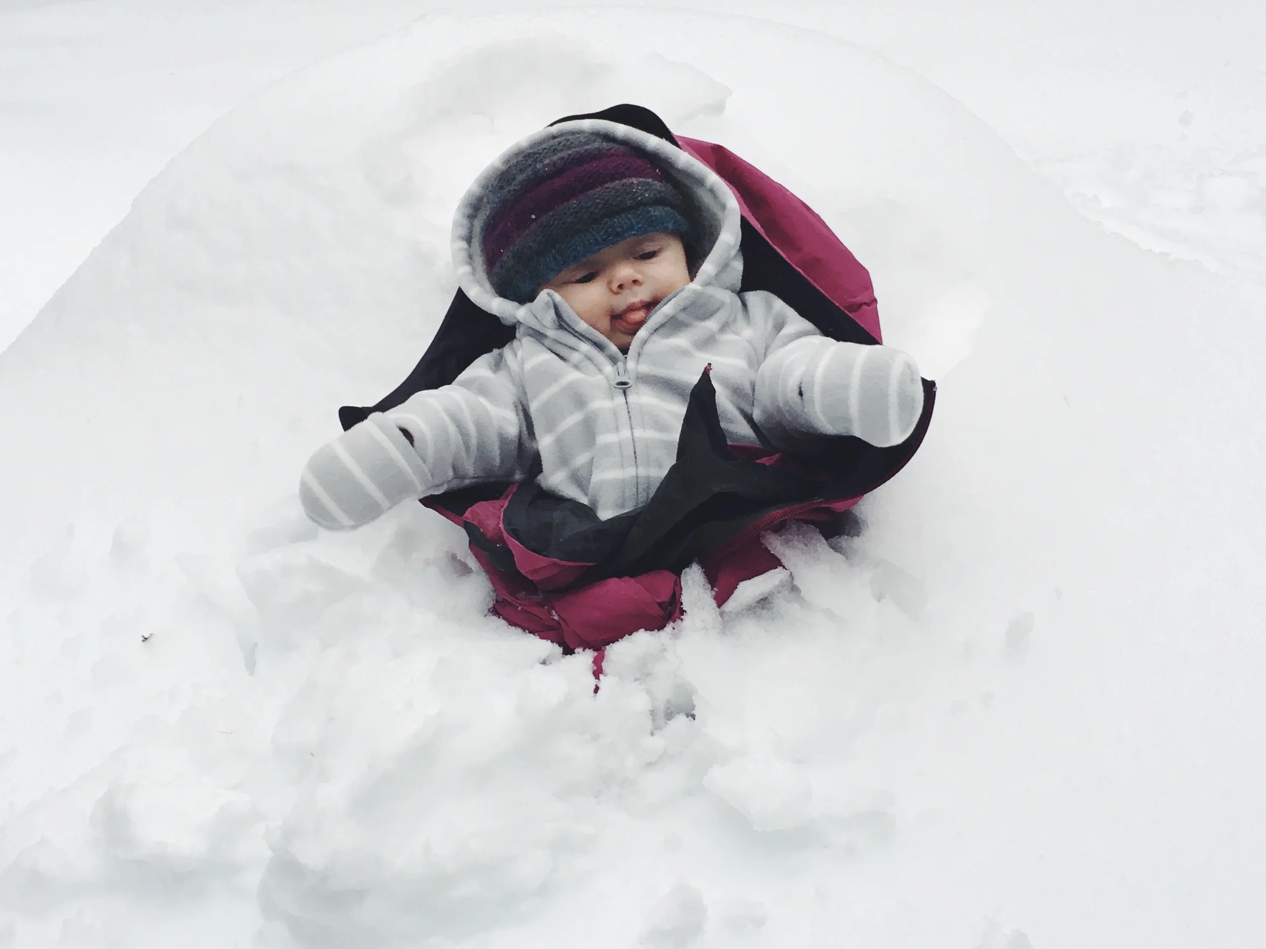 Playing in his first ever snow bank!