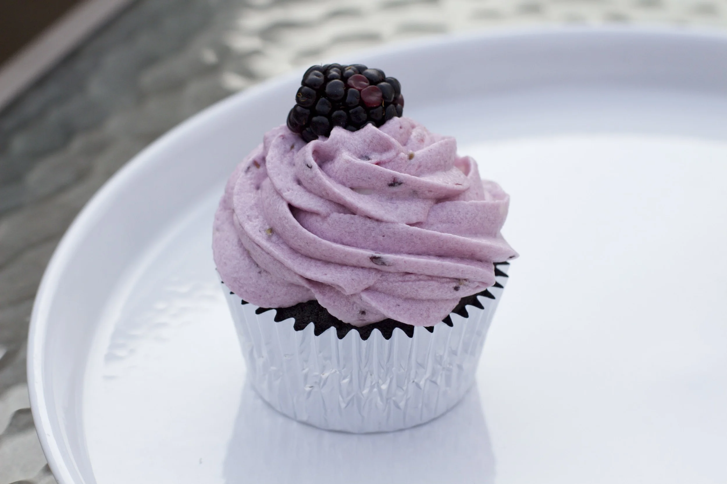 Chocolate cupcake with fresh blackberry buttercream and fresh blackberry