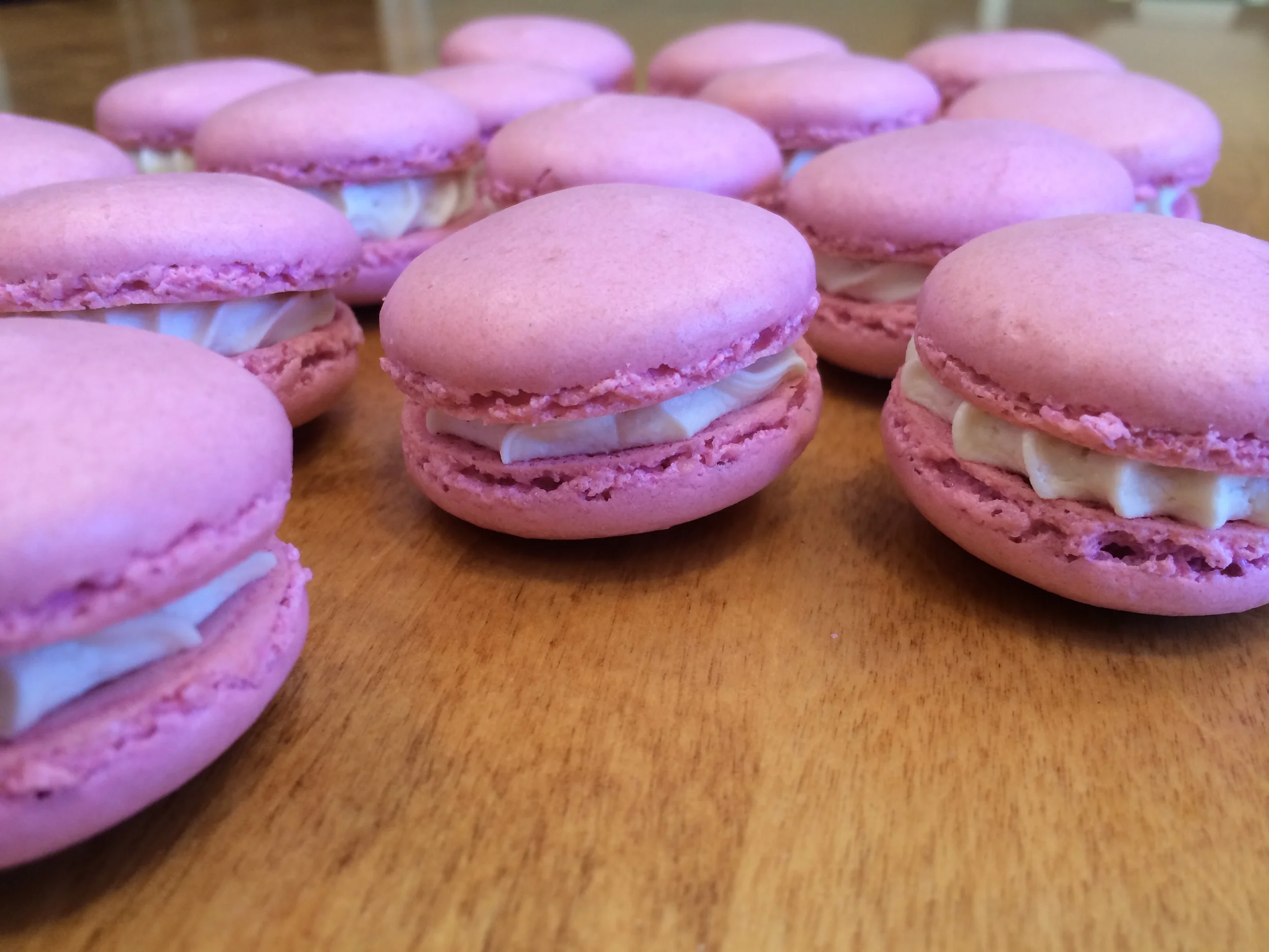 Berry macarons filled with marshmallow, whipped cream, and salted caramel buttercream